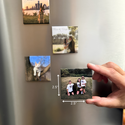 A hand holds a square custom photo magnet showing a family portrait, with dimension labels indicating 2.5 inches by 2.5 inches
